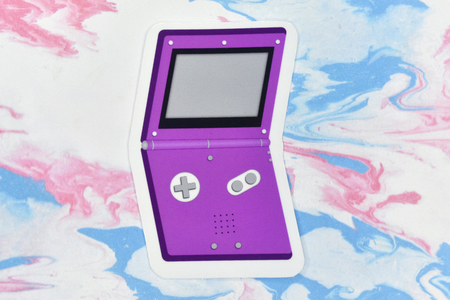 A vinyl sticker depicting a GameBoy Advance in the asexual pride flag colours.
