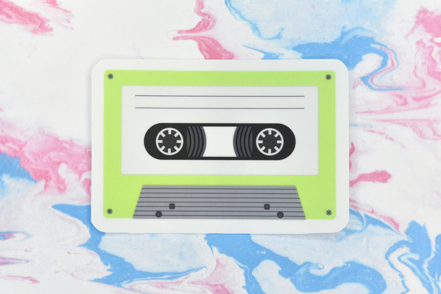 An LGBTQ+ pride vinyl sticker depicting a cassette tape in the agender pride flag colours.