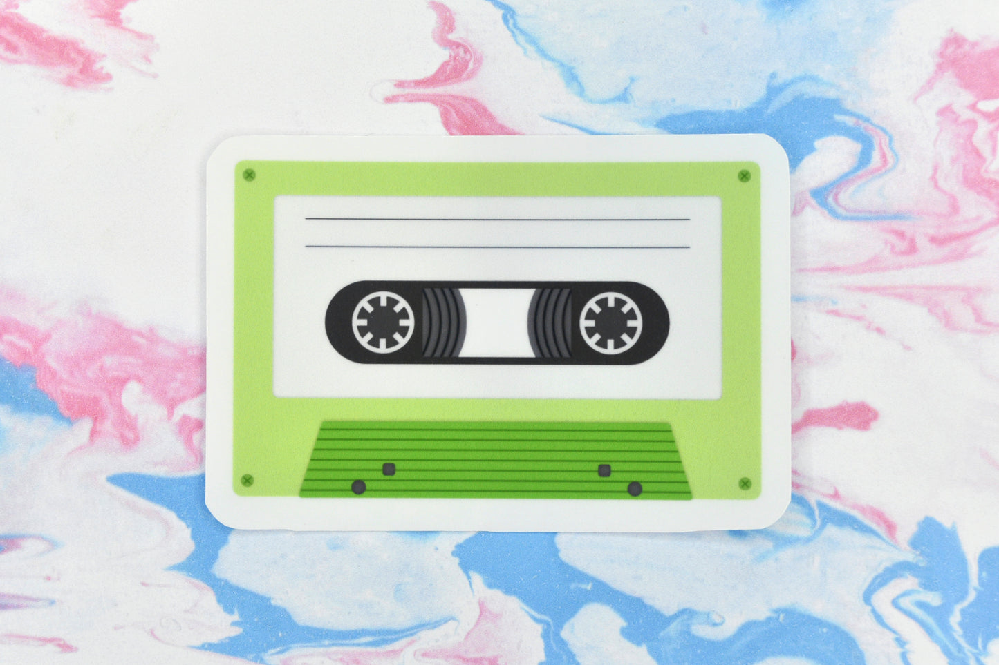 An LGBTQ+ pride vinyl sticker depicting a cassette tape in the aromantic pride flag colours.