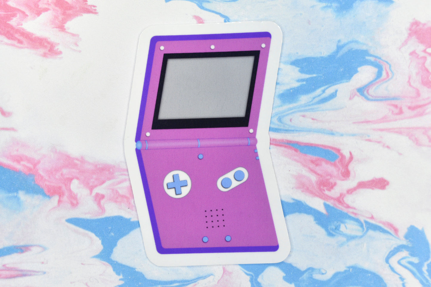 A vinyl sticker depicting a GameBoy Advance in the bisexual pride flag colours.