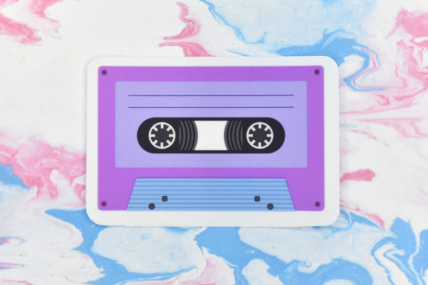 An LGBTQ+ pride vinyl sticker depicting a cassette tape in the bisexual pride flag colours.