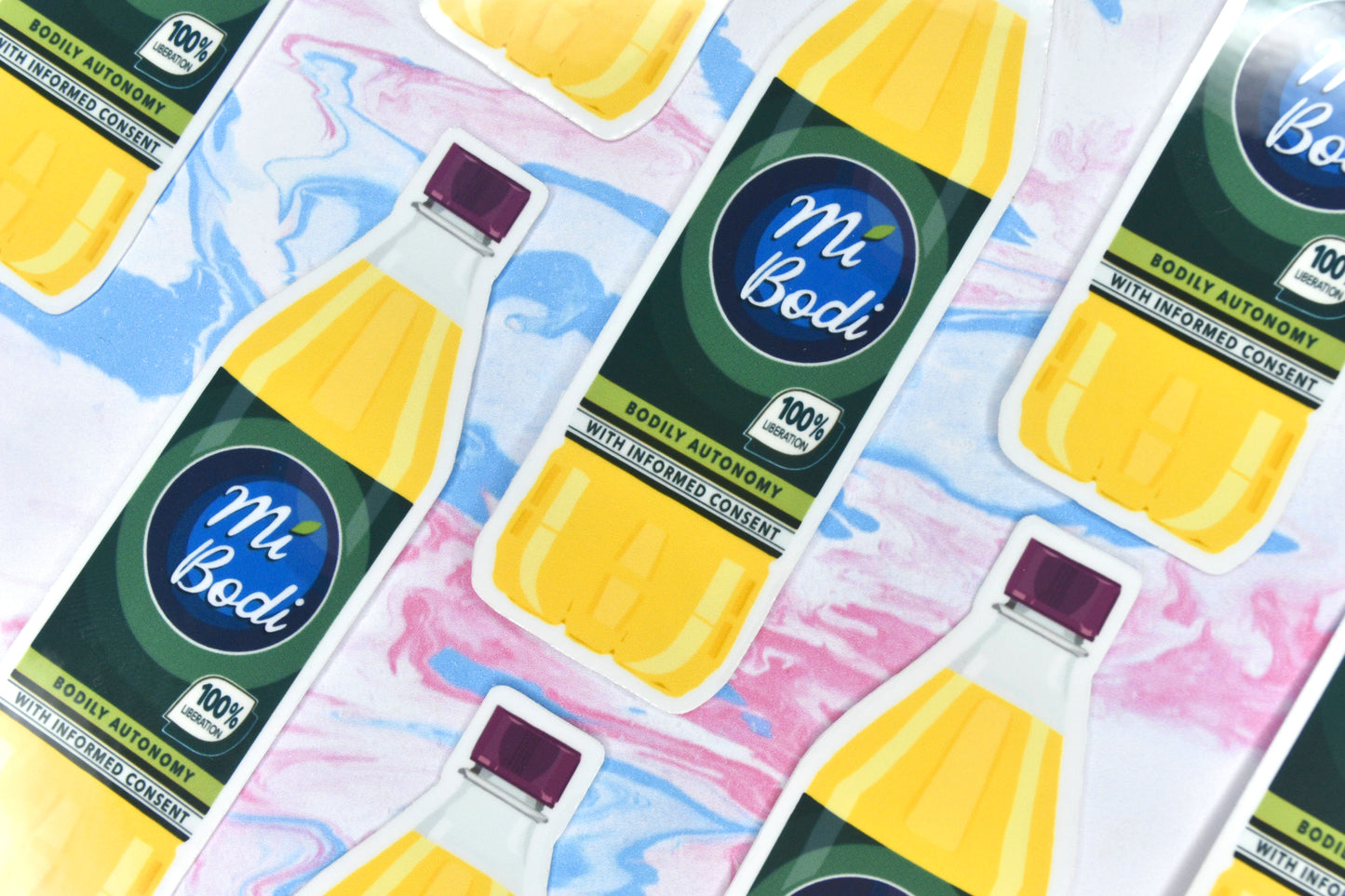 A close-up of a collection of eight of the Mi Bodi vinyl stickers