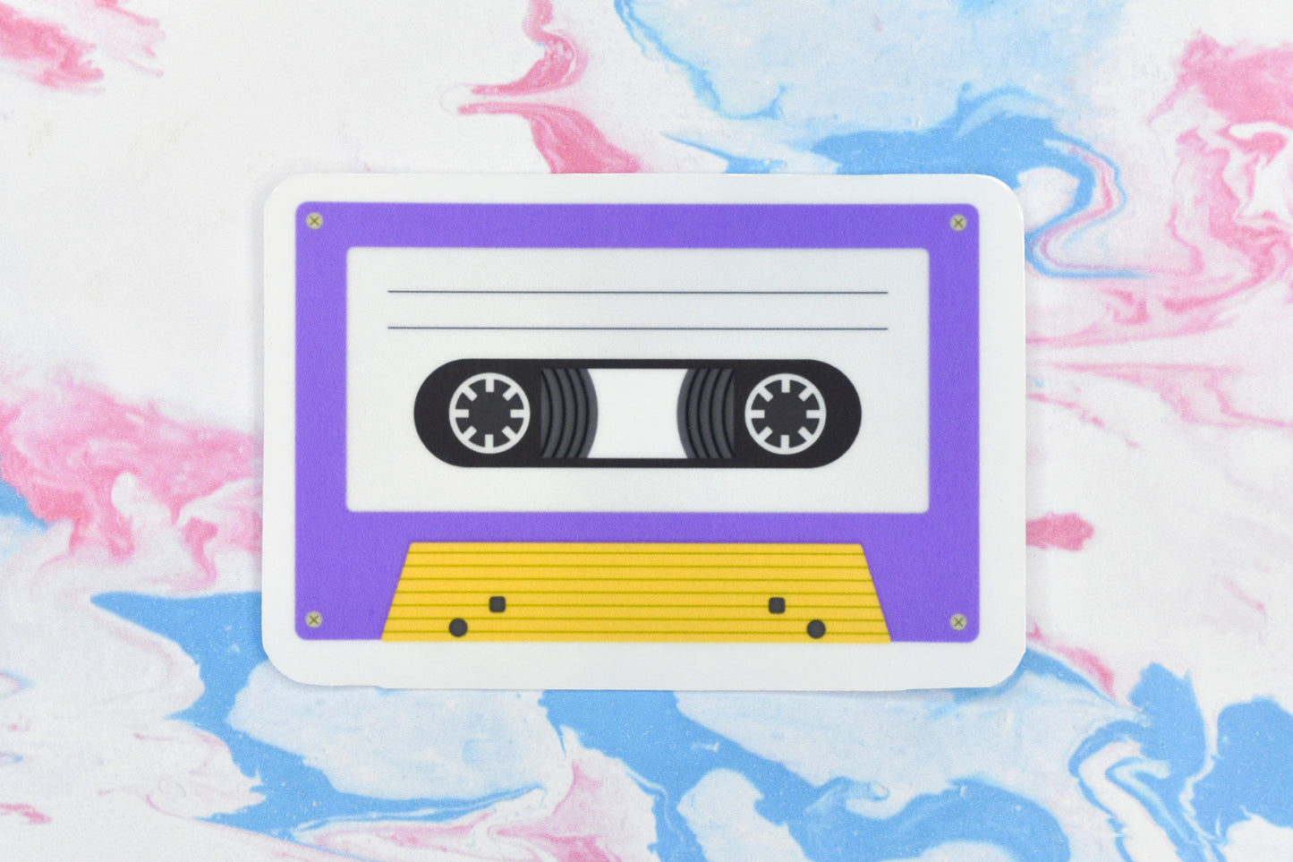 An LGBTQ+ pride vinyl sticker depicting a cassette tape in the non-binary pride flag colours.