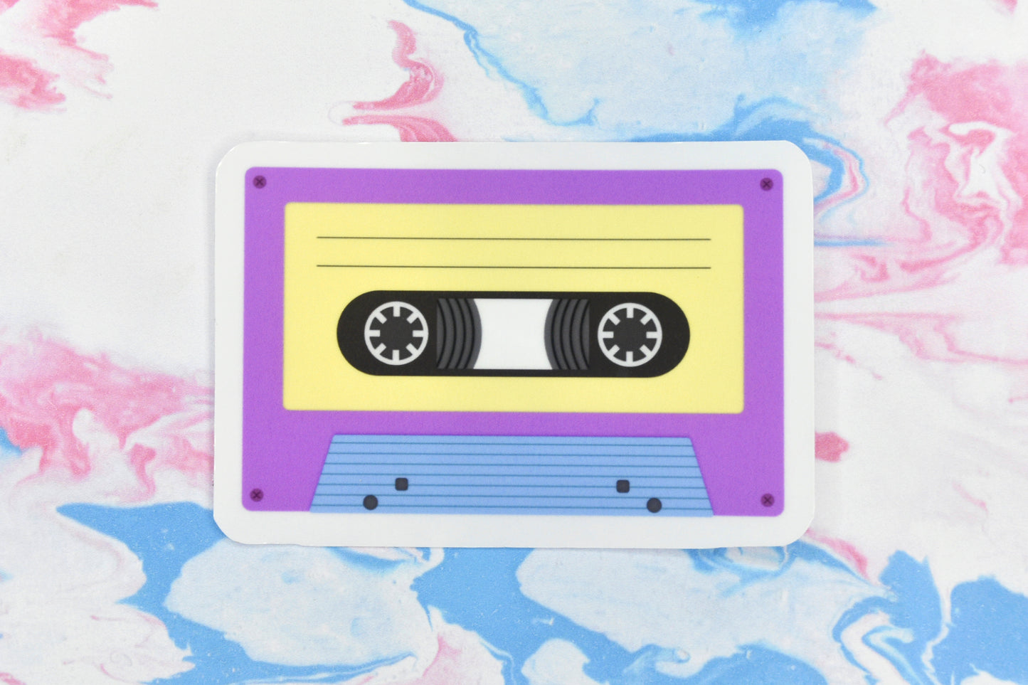 An LGBTQ+ pride vinyl sticker depicting a cassette tape in the pansexual pride flag colours.