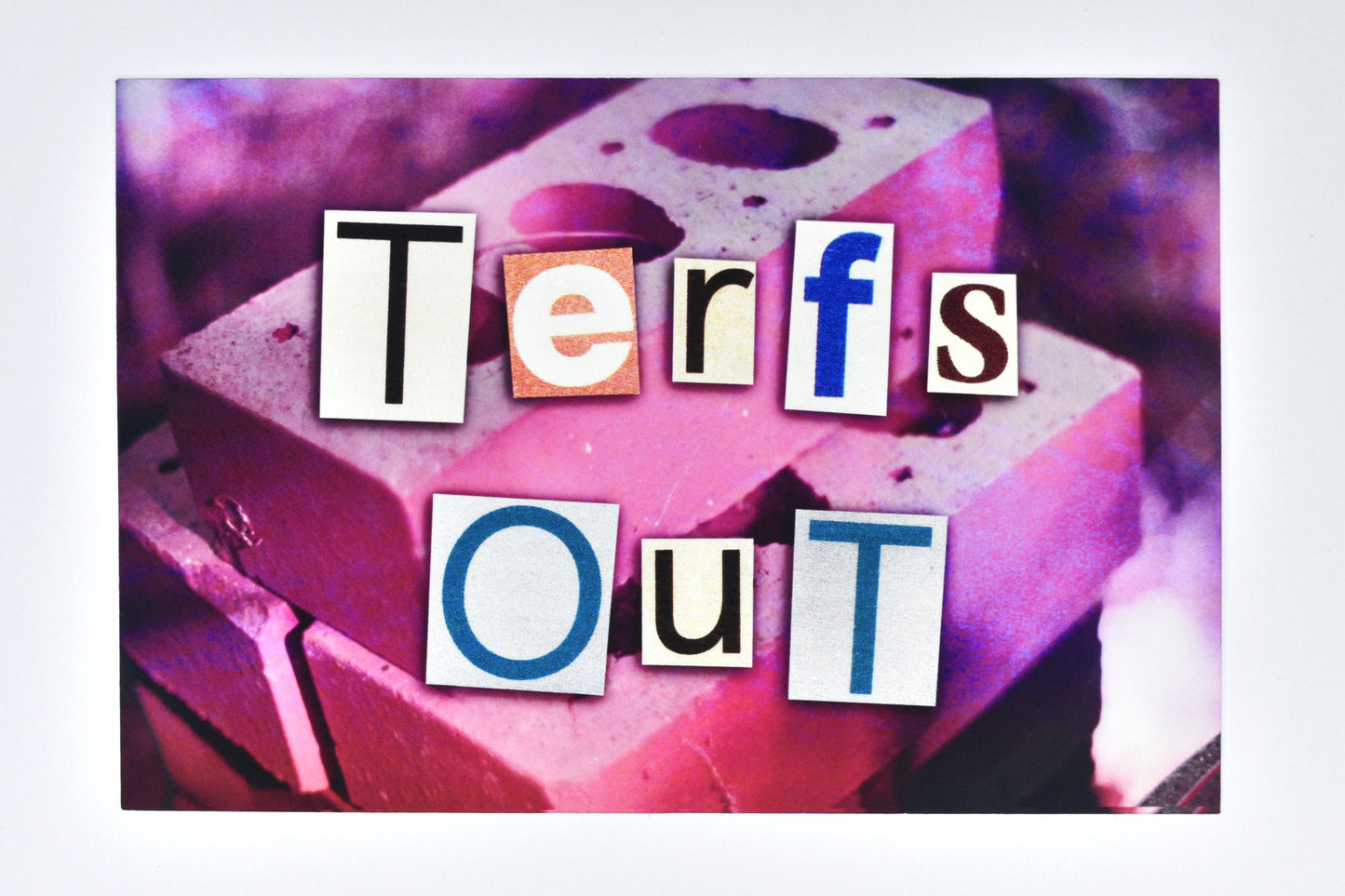 Trans pride collage design featuring text reading "TERFs Out" overlaid on a photograph of some bricks with a pink filter.
